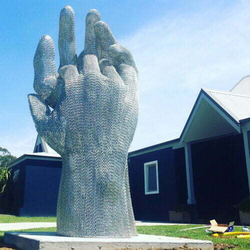 Large hands sculpture in stainless steel